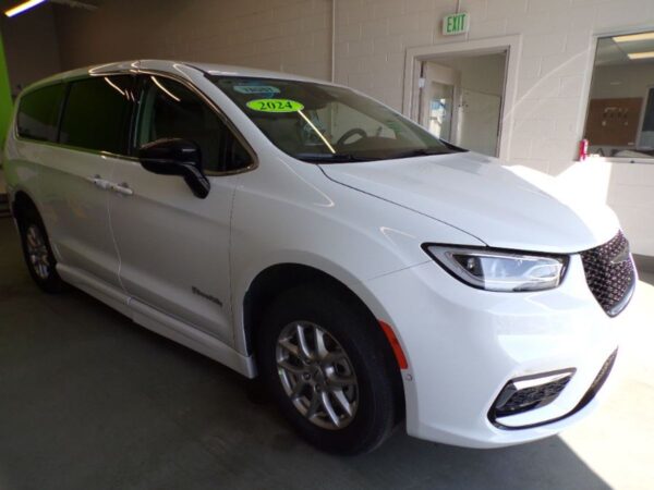 White Chrysler Pacifica with BraunAbility Side Entry Automatic Fold Out conversion