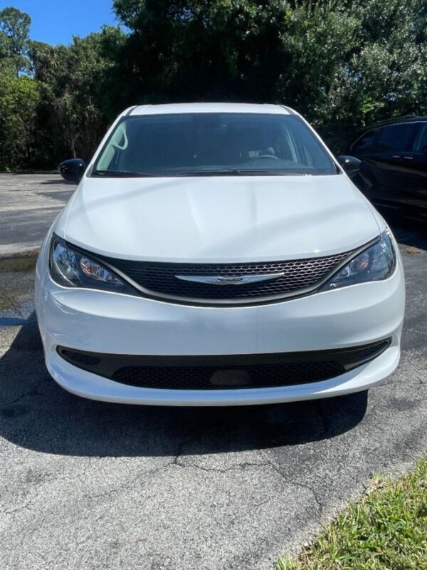 White Chrysler Voyager with Driverge Side Entry Automatic Fold Out conversion