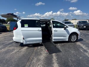 White Chrysler Voyager with Driverge Side Entry Automatic Fold Out conversion