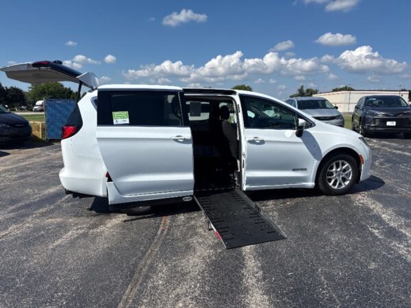 White Chrysler Voyager with Driverge Side Entry Automatic Fold Out conversion