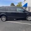 Black Dodge Grand Caravan with Adaptive Vans Side Entry Automatic Fold Out conversion