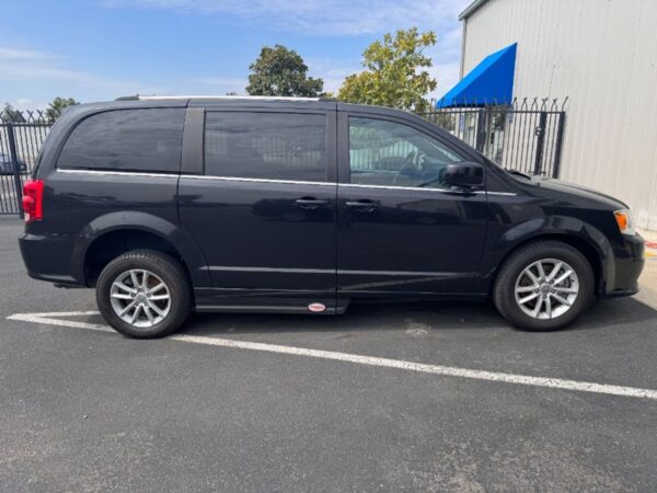 Black Dodge Grand Caravan with Adaptive Vans Side Entry Automatic Fold Out conversion