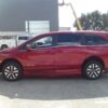 Red Honda Odyssey with BraunAbility Side Entry Automatic In Floor conversion