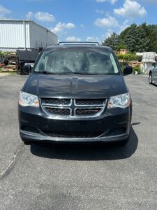 Black Dodge Grand Caravan with BraunAbility Side Entry Automatic Fold Out conversion