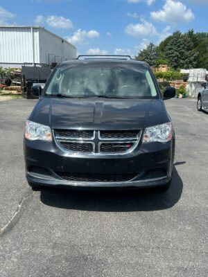 Black Dodge Grand Caravan with BraunAbility Side Entry Automatic Fold Out conversion