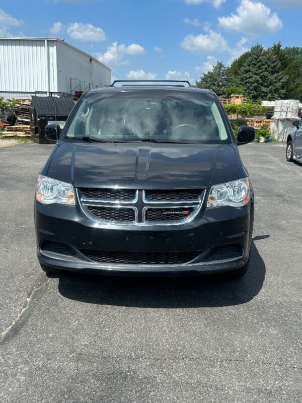 Black Dodge Grand Caravan with BraunAbility Side Entry Automatic Fold Out conversion