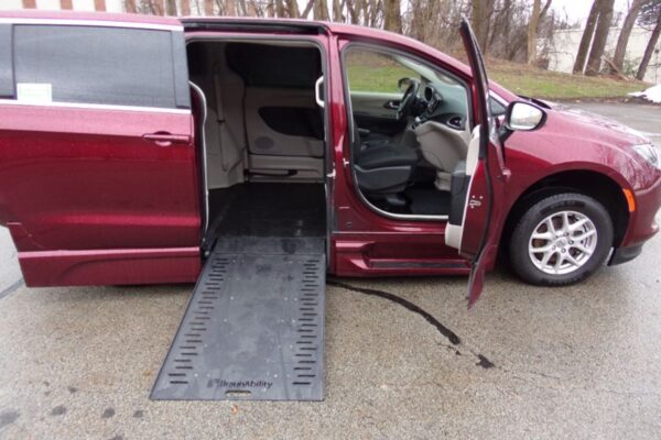 Red Chrysler Voyager with BraunAbility Side Entry Automatic In Floor conversion