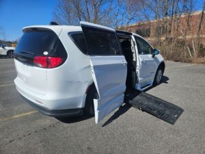 White Chrysler Voyager with BraunAbility Side Entry Automatic Fold Out conversion