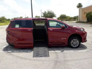 Red Toyota Sienna with BraunAbility Side Entry Automatic Fold Out conversion