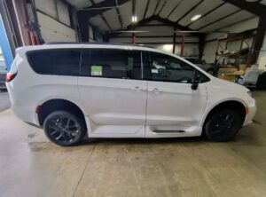 White Chrysler Pacifica with Driverge Rear Entry Manual Fold Out conversion