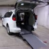 White Chrysler Voyager with Driverge Rear Entry Manual Fold Out conversion