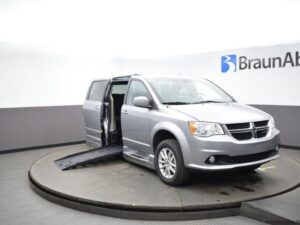 Silver Dodge Grand Caravan with BraunAbility Side Entry Automatic Fold Out conversion