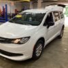 White Chrysler Voyager with BraunAbility Rear Entry Manual Fold Out conversion