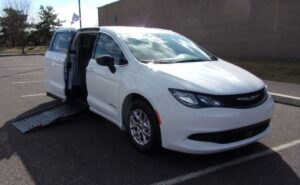 White Chrysler Voyager with Driverge Side Entry Automatic Fold Out conversion