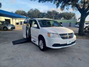 White Dodge Grand Caravan with BraunAbility Side Entry Automatic In Floor conversion
