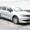 Silver Chrysler Voyager with BraunAbility Rear Entry Manual Fold Out conversion