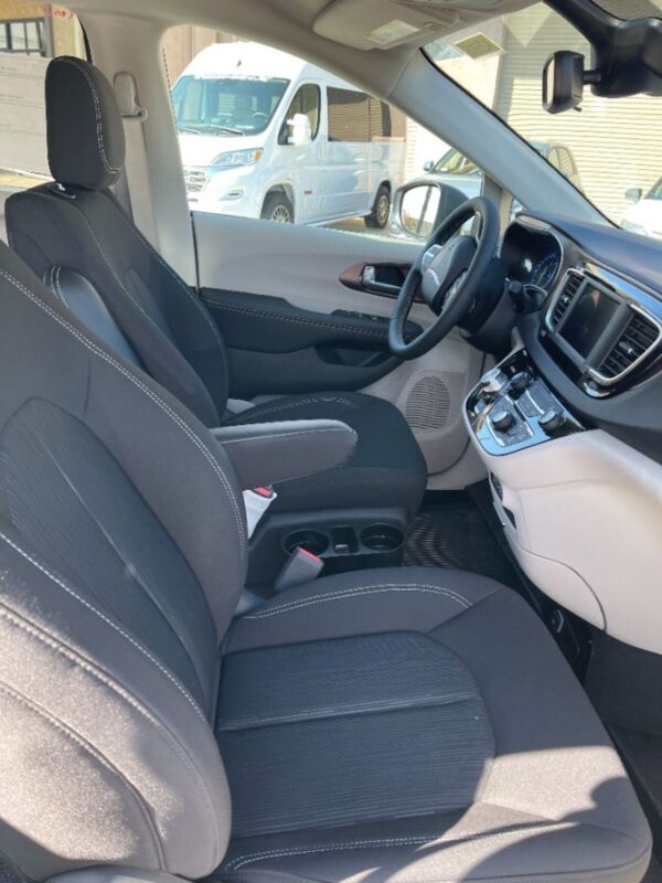 White Chrysler Voyager with Driverge Side Entry Automatic Fold Out conversion