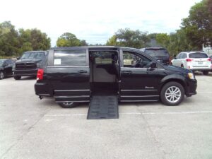 Black Dodge Grand Caravan with BraunAbility Side Entry Automatic Fold Out conversion