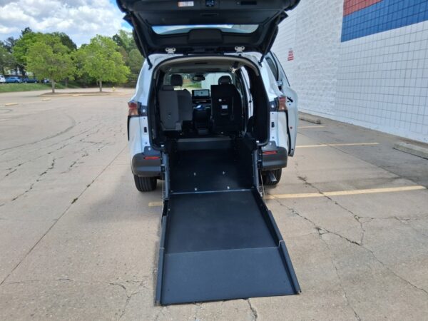 White Toyota Sienna with Driverge Rear Entry Manual Fold Out conversion