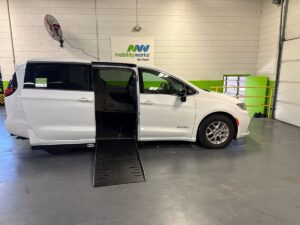 White Chrysler Pacifica with Driverge Side Entry Automatic Fold Out conversion