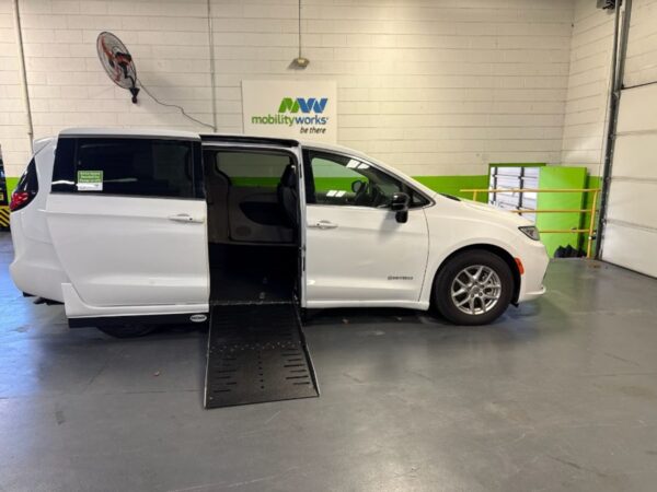 White Chrysler Pacifica with Driverge Side Entry Automatic Fold Out conversion