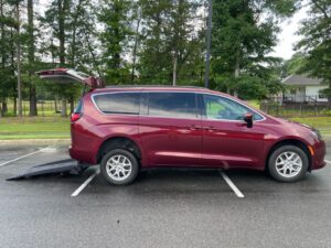 Red Chrysler Voyager with FR Conversions Rear Entry Manual Fold Out conversion