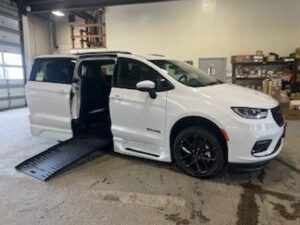 White Chrysler Pacifica with BraunAbility Side Entry Automatic Fold Out conversion