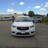 White Chrysler Pacifica with Driverge Side Entry Automatic Fold Out conversion