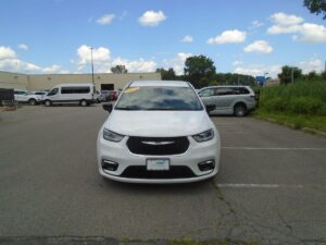 White Chrysler Pacifica with Driverge Side Entry Automatic Fold Out conversion