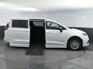 White Chrysler Pacifica with BraunAbility Side Entry Automatic Fold Out conversion