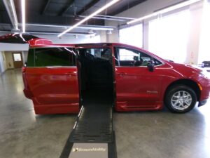 Red Chrysler Pacifica with BraunAbility Side Entry Automatic Fold Out conversion