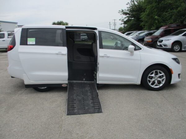 White Chrysler Pacifica with Adaptive Vans Side Entry Automatic Fold Out conversion