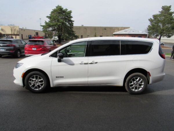 White Chrysler Voyager with Driverge Rear Entry Manual Fold Out conversion