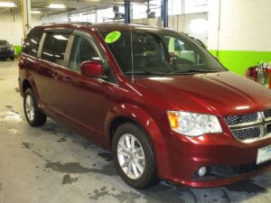 Red Dodge Grand Caravan with Adaptive Vans Rear Entry Manual Fold Out conversion