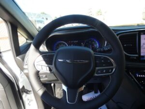 White Chrysler Pacifica with BraunAbility Side Entry Automatic Fold Out conversion