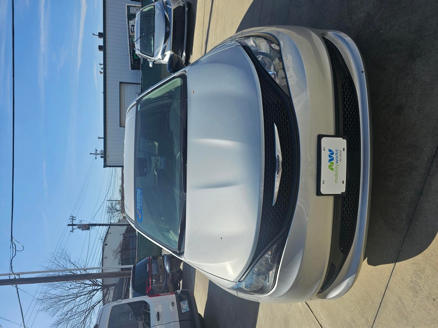 Silver Chrysler Voyager with BraunAbility Side Entry Manual Fold Out conversion