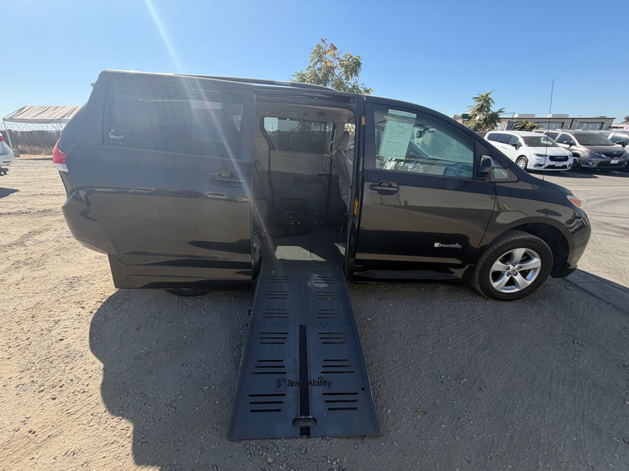 Black Toyota Sienna with BraunAbility Side Entry Automatic Fold Out conversion