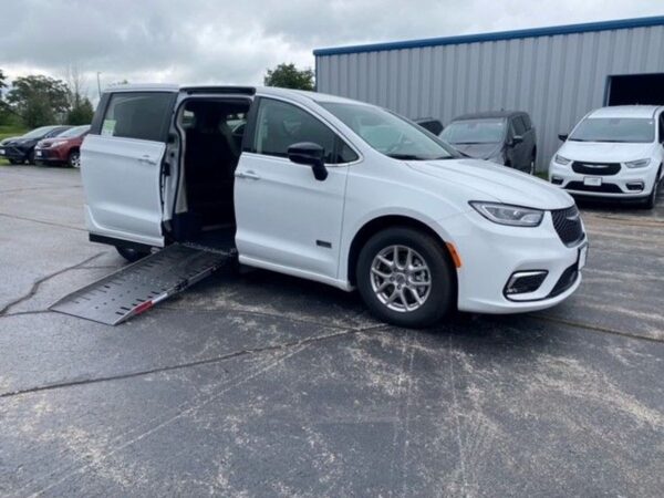 White Chrysler Pacifica with Driverge Side Entry Automatic Fold Out conversion