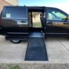 Black Dodge Grand Caravan with Driverge Side Entry Automatic Fold Out conversion