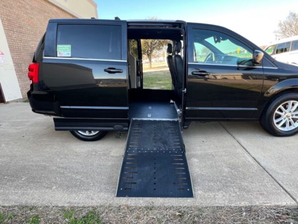 Black Dodge Grand Caravan with Driverge Side Entry Automatic Fold Out conversion