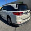 White Honda Odyssey with BraunAbility Side Entry Automatic In Floor conversion