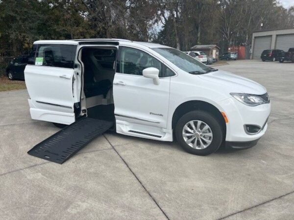 White Chrysler Pacifica with BraunAbility Side Entry Automatic Fold Out conversion