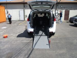 White Chrysler Pacifica with Driverge Rear Entry Manual Fold Out conversion