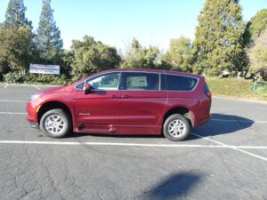 Red Chrysler Voyager with BraunAbility Side Entry Automatic Fold Out conversion