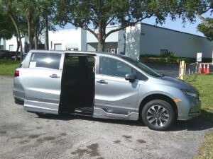 Silver Honda Odyssey with BraunAbility Side Entry Automatic In Floor conversion