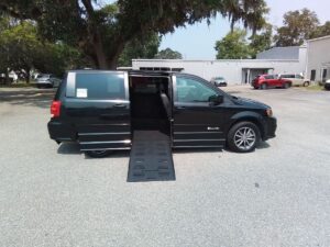 Black Dodge Grand Caravan with BraunAbility Side Entry Manual Fold Out conversion