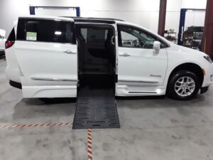 White Chrysler Pacifica with BraunAbility Side Entry Automatic Fold Out conversion