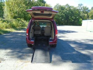 Red Dodge Grand Caravan with ATS Rear Entry Manual Fold Out conversion