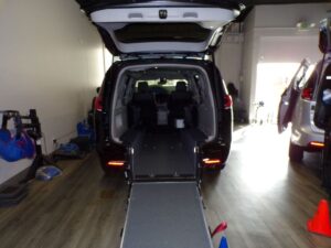 Black Chrysler Pacifica with Driverge Rear Entry Manual Fold Out conversion