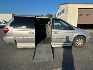 Silver Chrysler Town and Country with BraunAbility Side Entry Automatic Fold Out conversion